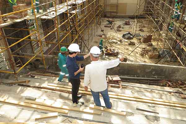 Contract administrator overlooking building site