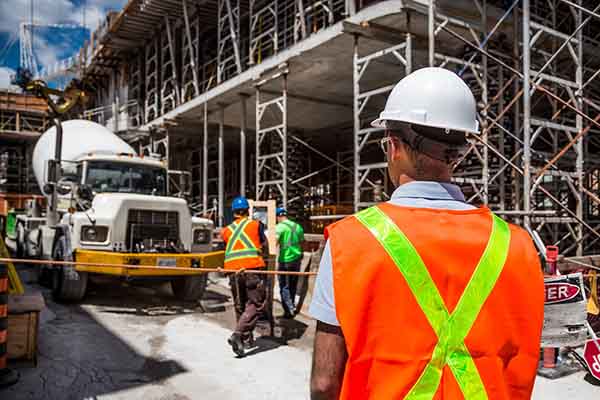 Cost consultant monitoring concrete delivery