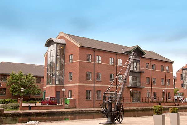 Industrial building next to a canal using planned preventative maintenance